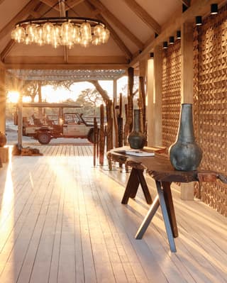 The lodge reception area showing a safari jeep at the entrance